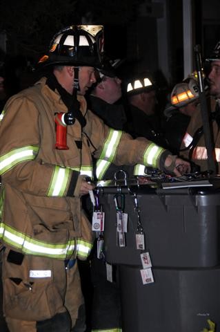 Firefighter Brian Brown manages the manpower pool.